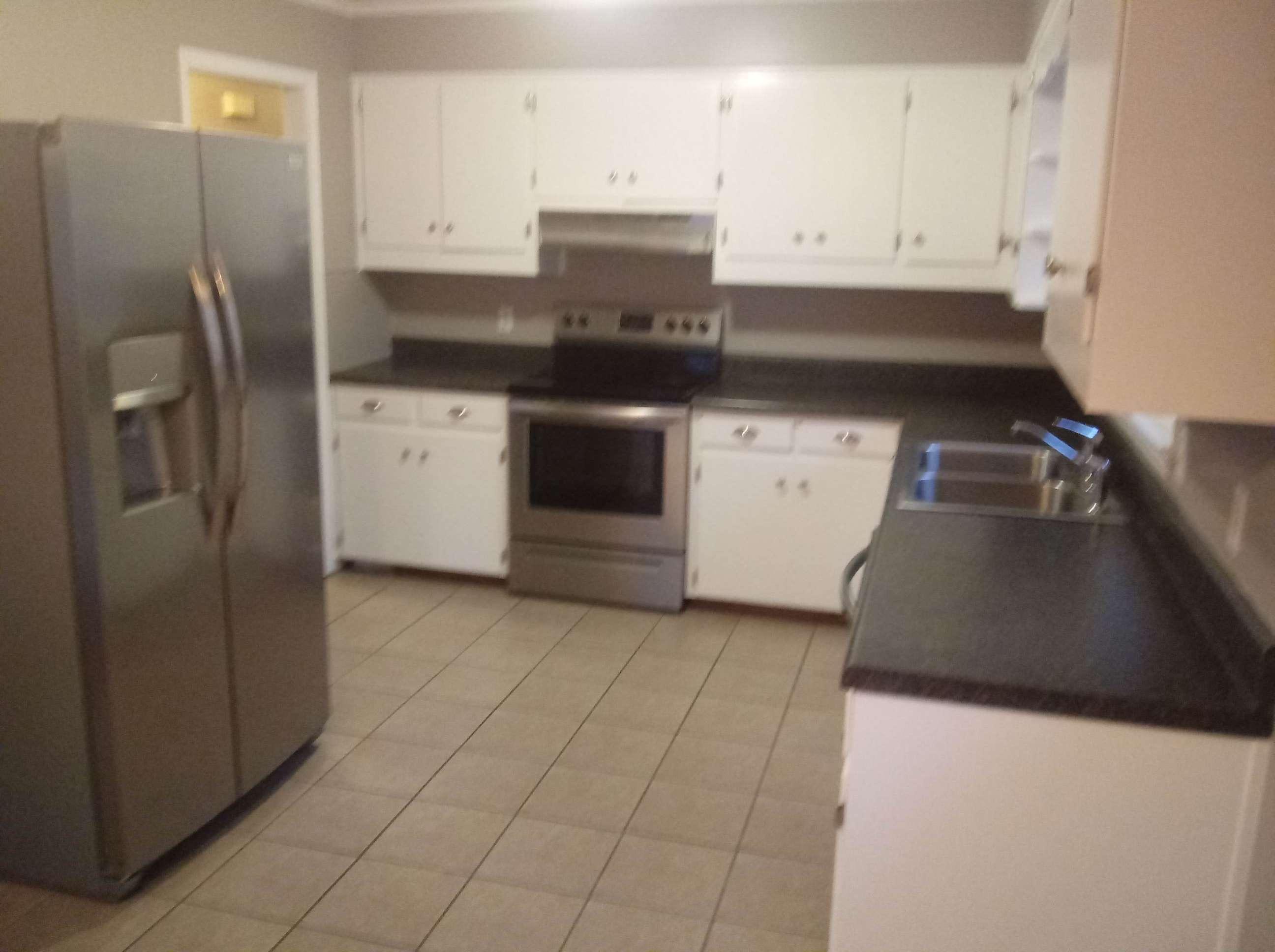 5536 Blue Ridge Drive Hurt, VA 24563 - Photo 2 of 14 a kitchen with a stove and a refrigerator