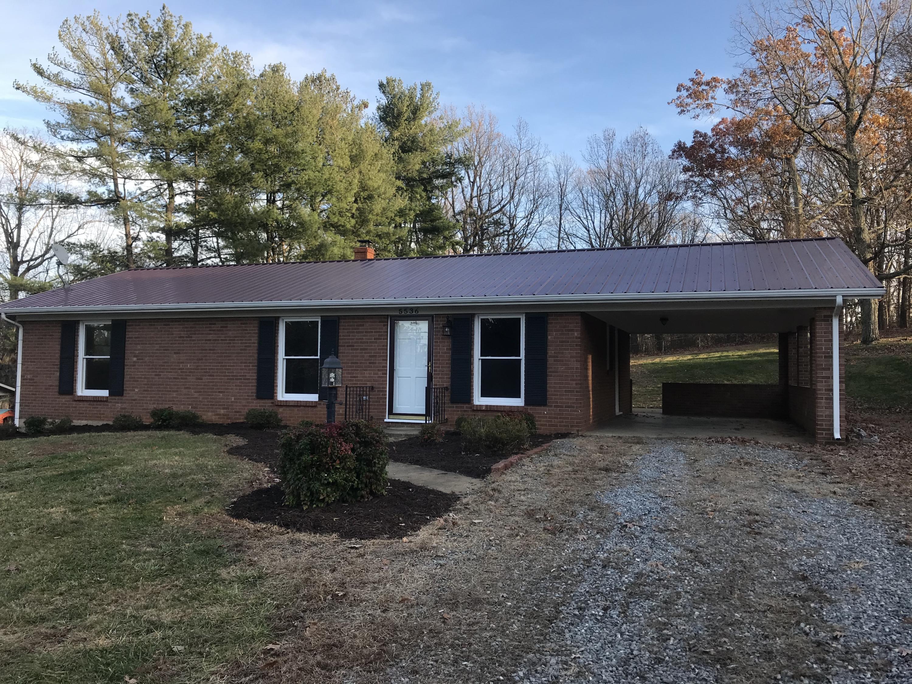 5536 Blue Ridge Drive Hurt, VA 24563 - Photo 13 of 14 a front view of a house with garden