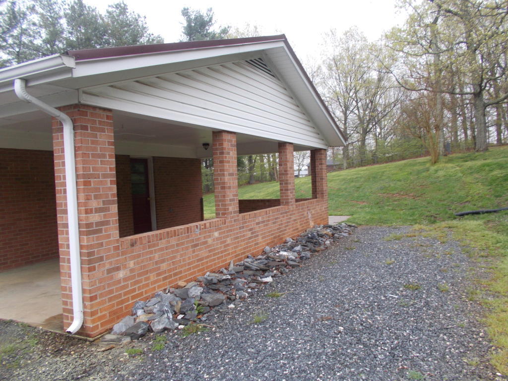 5536 Blue Ridge Drive Hurt, VA 24563 - Photo 14 of 14 a view of a house with backyard and garden