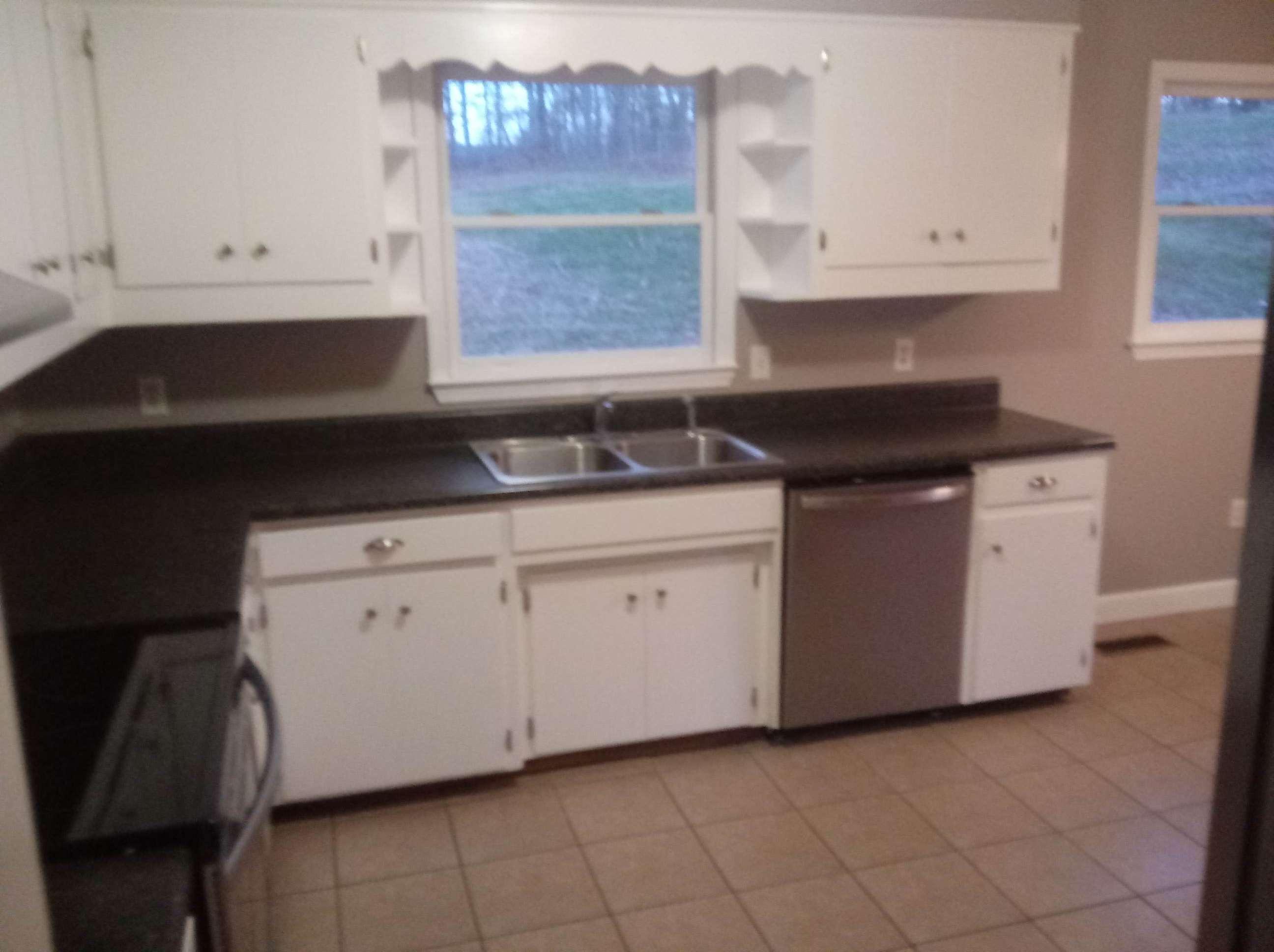 5536 Blue Ridge Drive Hurt, VA 24563 - Photo 3 of 14 a kitchen with granite countertop white cabinets and a stove