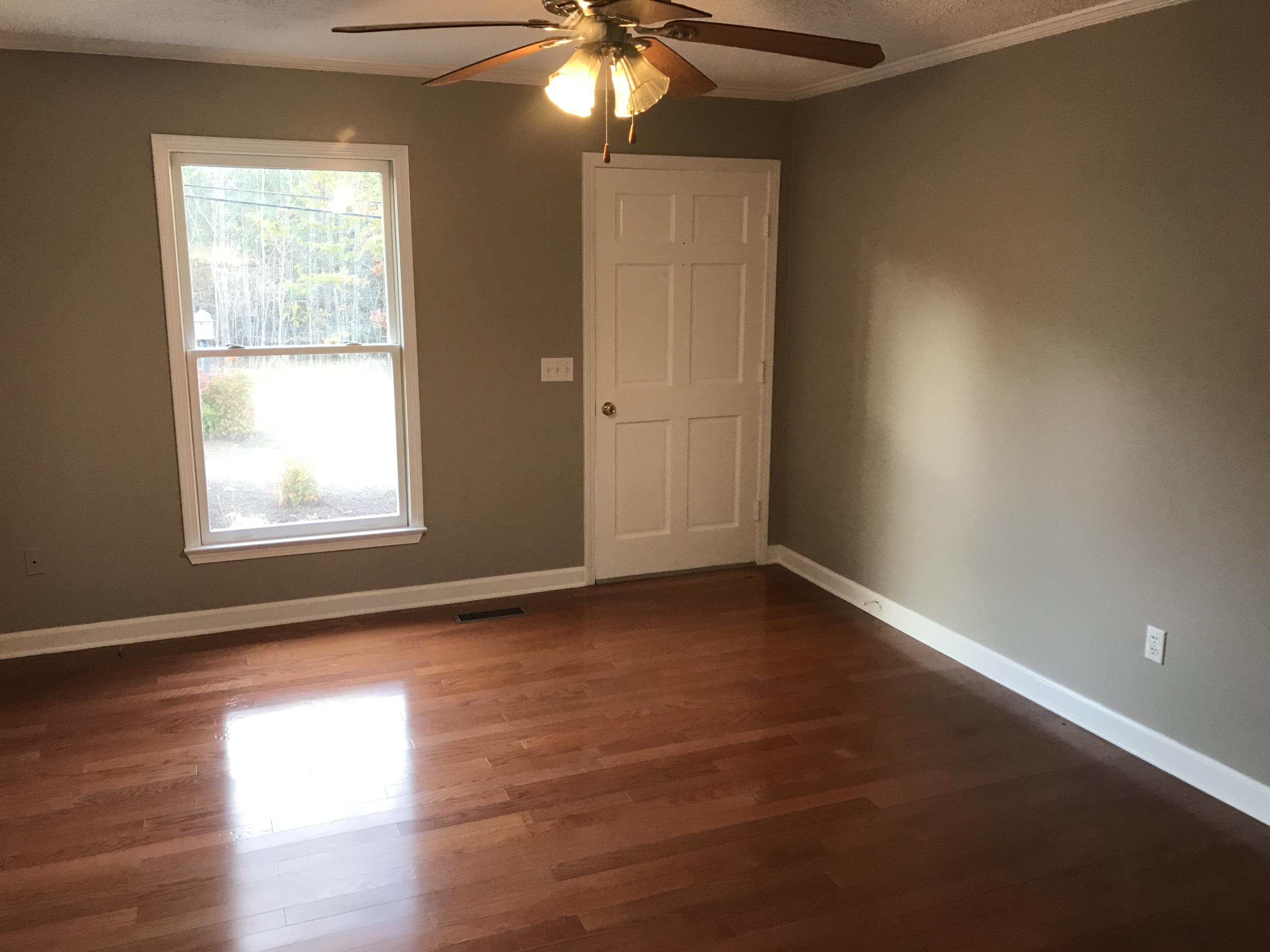 5536 Blue Ridge Drive Hurt, VA 24563 - Photo 10 of 14 an empty room with wooden floor and windows
