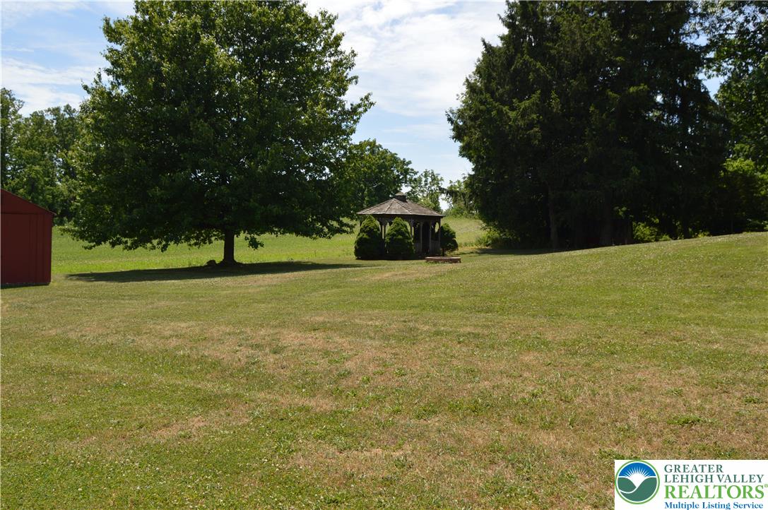 1819 Blue Barn Road Orefield, PA 18069 - Photo 5 of 21 A classic gazebo sits amidst a verdant landscape, offering a serene outdoor retreat.