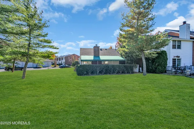 a view of a garden with a building in the background