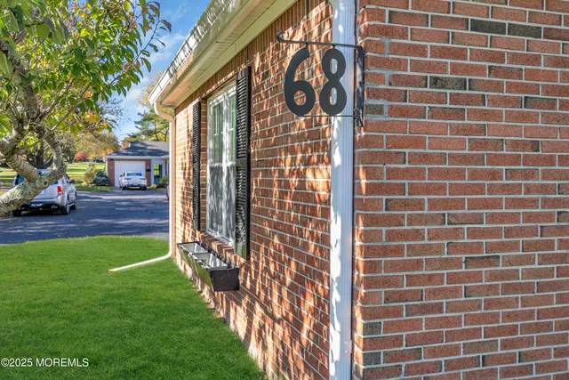 a brick building with a sign on it