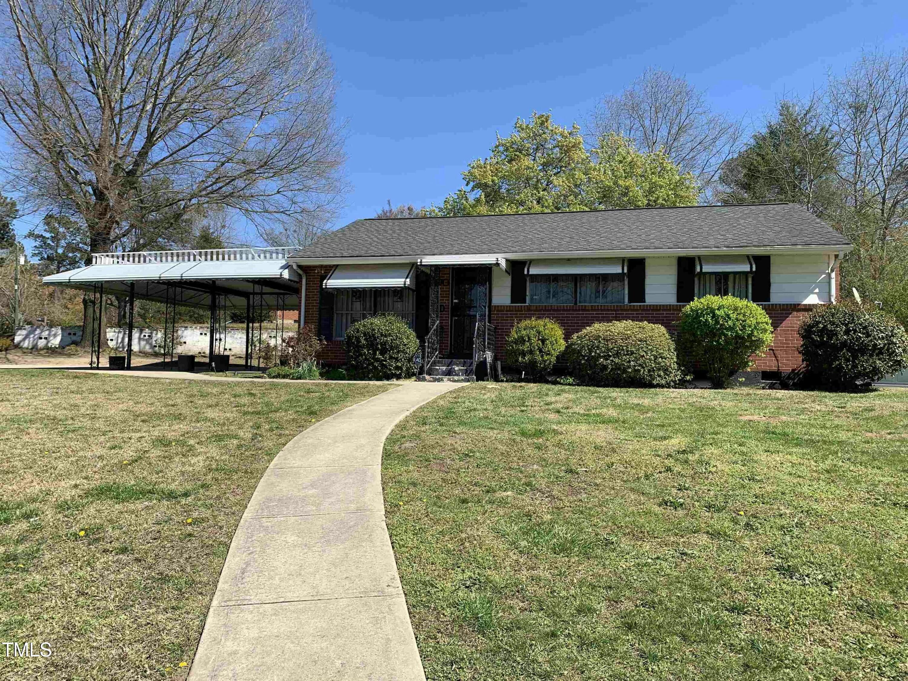 1100 Hadley Road Raleigh, NC 27610 - Photo 2 of 3 a front view of a house with a yard