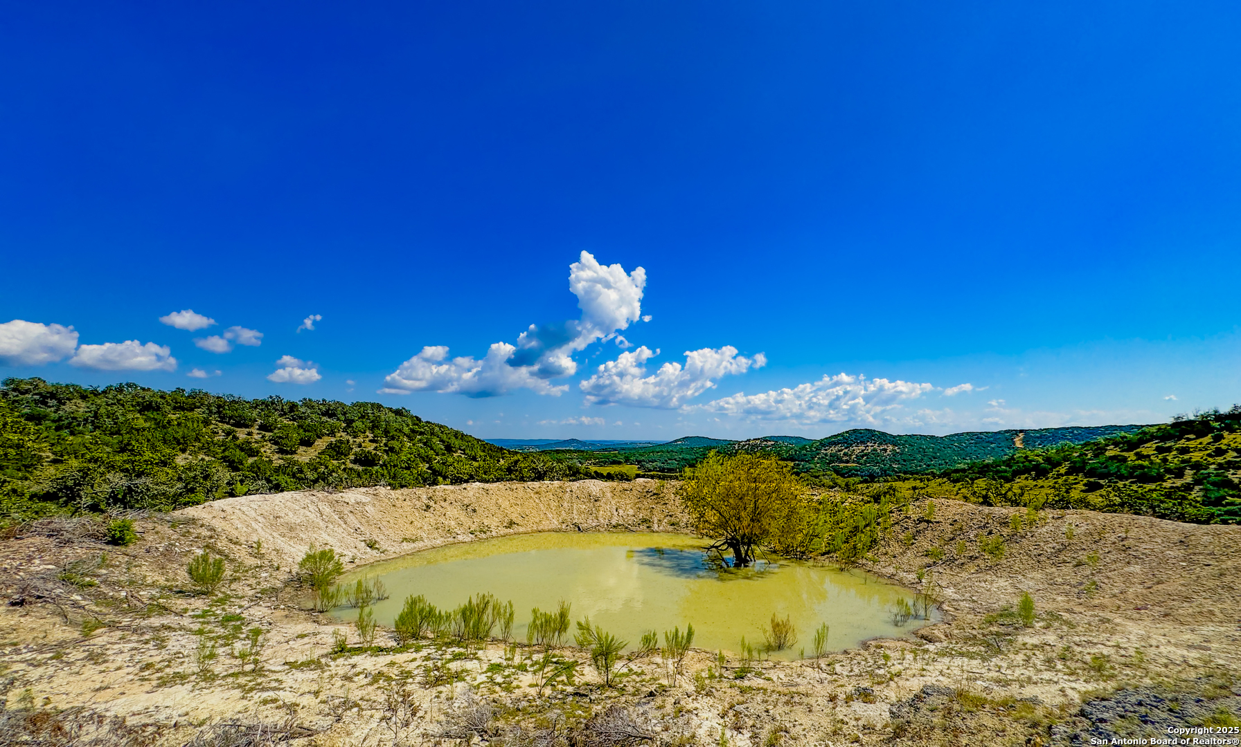 380 Holiday Road Comfort, TX 78013 - Photo 3 of 19 a swimming pool with outdoor seating