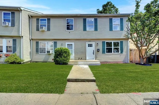 a view of a house with a garden