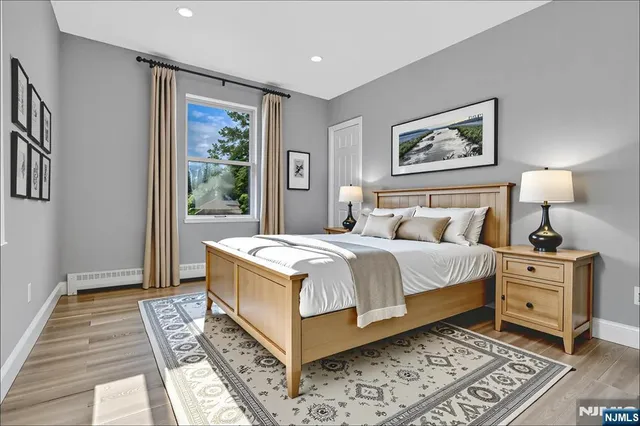 a spacious bedroom with a large bed and a window