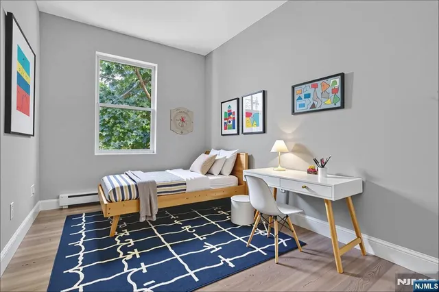 a theatre with furniture and a rug