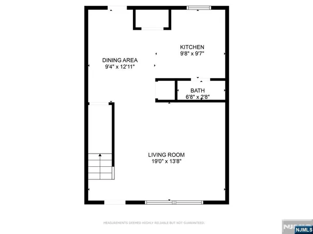 a picture of a bench in front of a wall