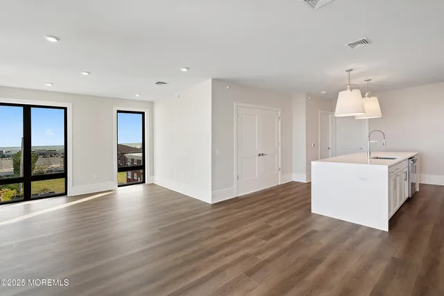 a view of a bathroom with wooden floor