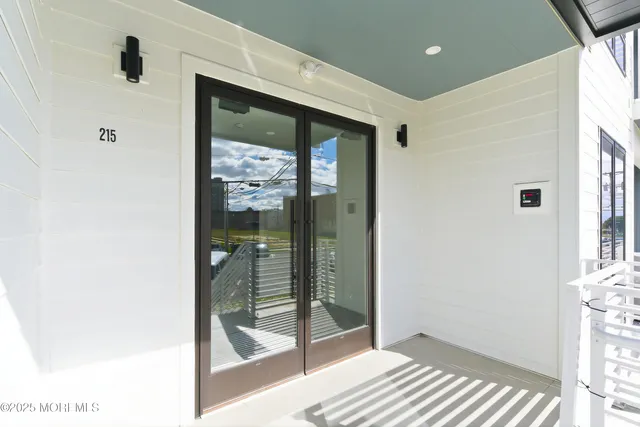 a large white kitchen with a stove a sink and a refrigerator