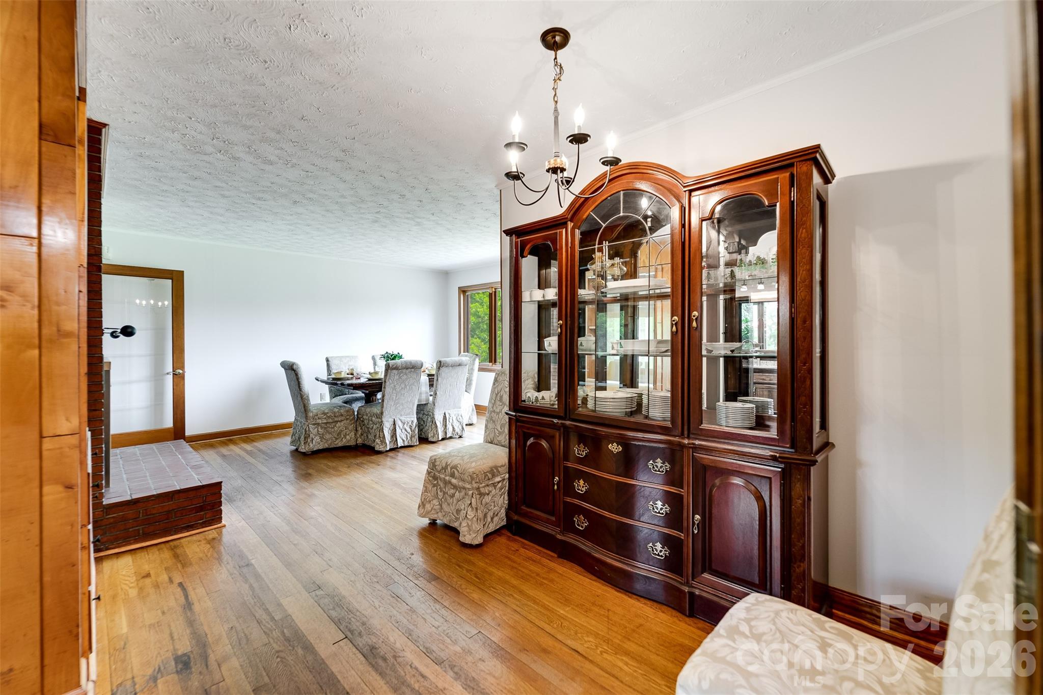 181 Fisher Crk Road Sylva, NC 28779 - Photo 11 of 48 a view of living room filled with furniture and wooden floor