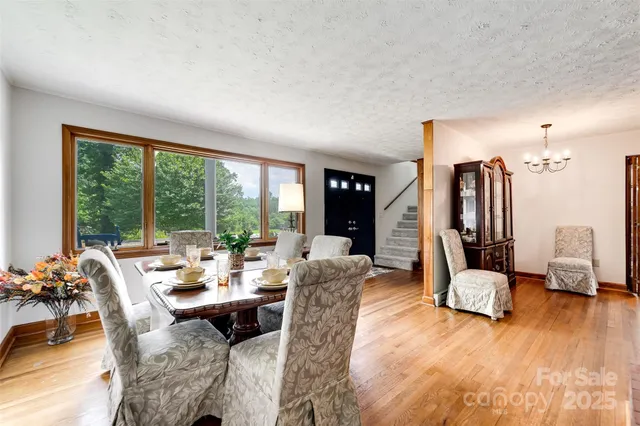 a living room with furniture and large windows