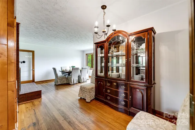 a view of living room filled with furniture and wooden floor