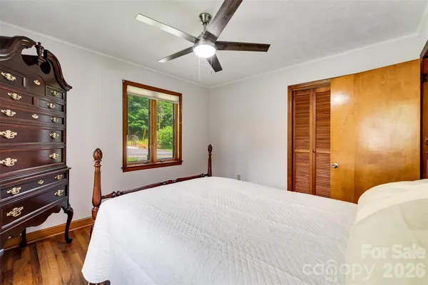 a bedroom with a bed and a table