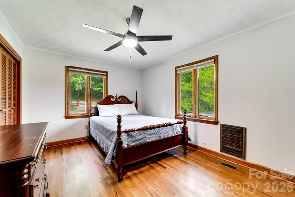 a bed room with a bed and a window