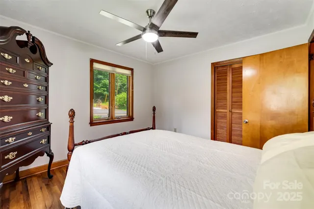 a bed room with a bed and a window