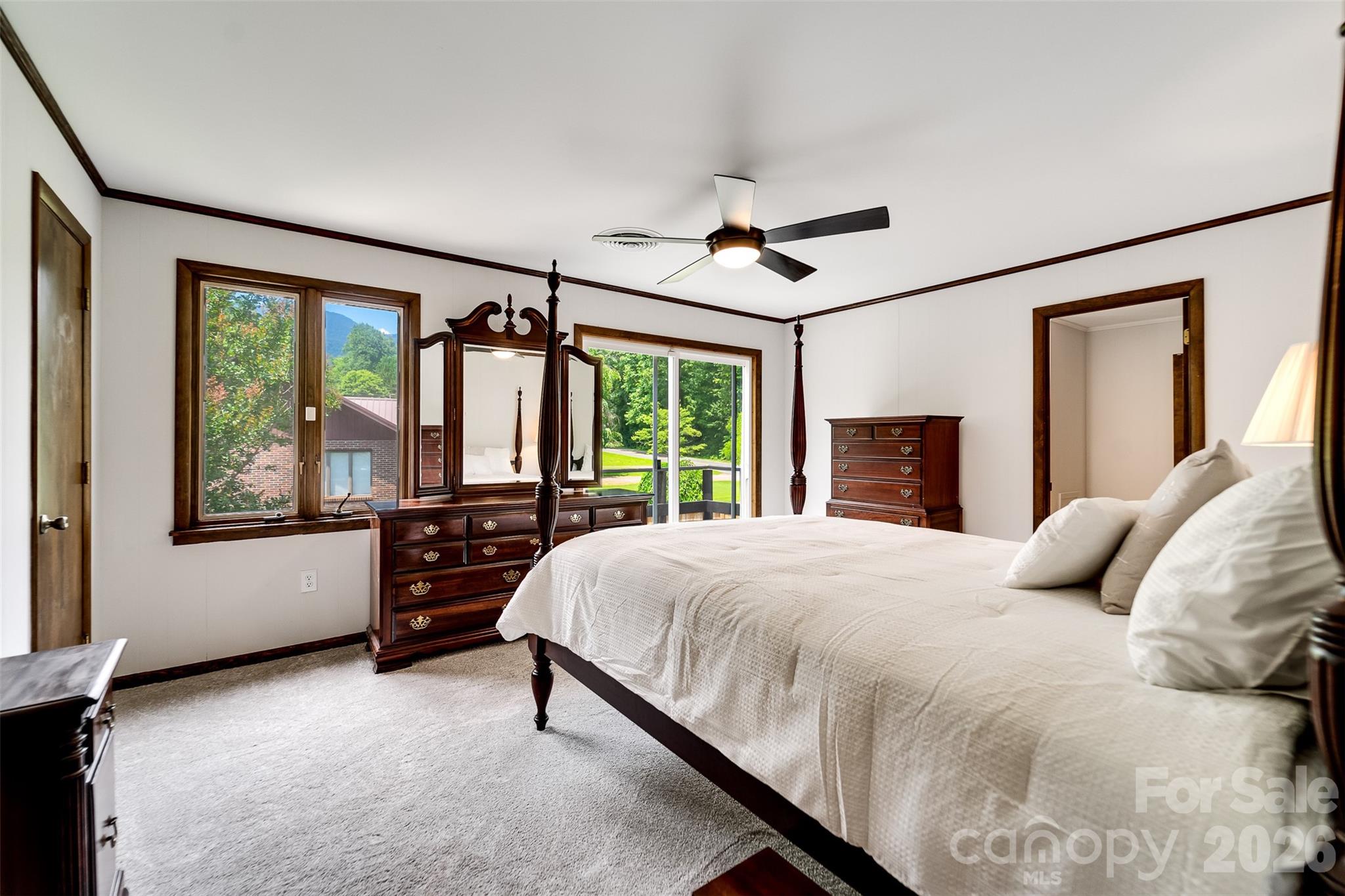 181 Fisher Crk Road Sylva, NC 28779 - Photo 29 of 48 a bedroom with a large bed and a large window