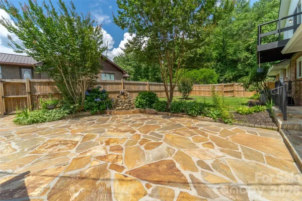 a view of a backyard of the house