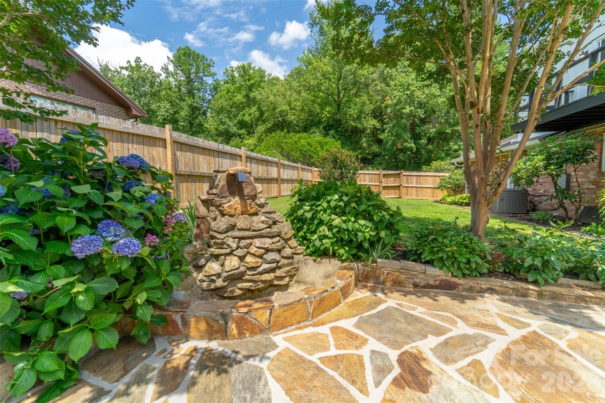181 Fisher Crk Road Sylva, NC 28779 - Photo 34 of 48 a view of a garden with large trees