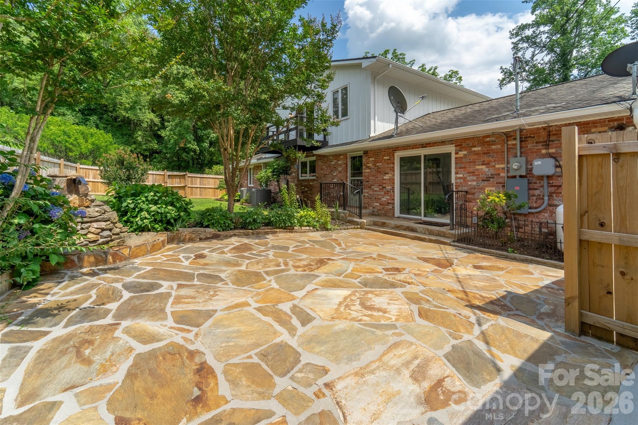 181 Fisher Crk Road Sylva, NC 28779 - Photo 35 of 48 a front view of a house with garden