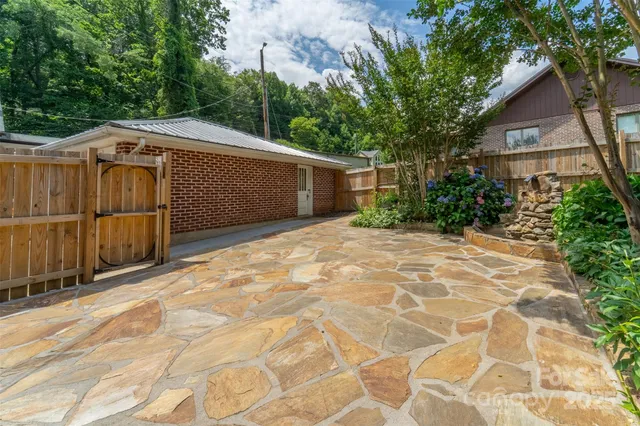 a view of a backyard of the house