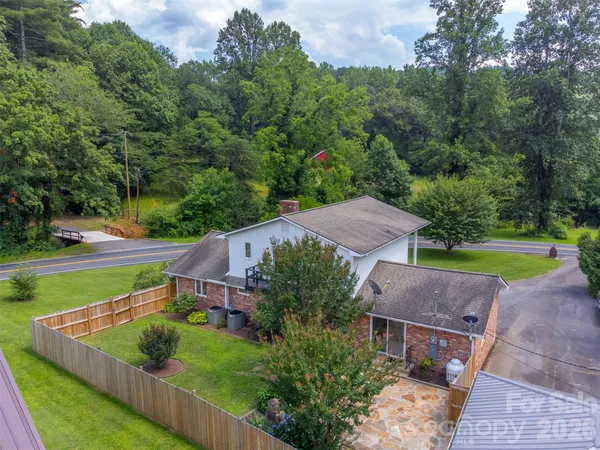 an aerial view of a house with outdoor space and street view