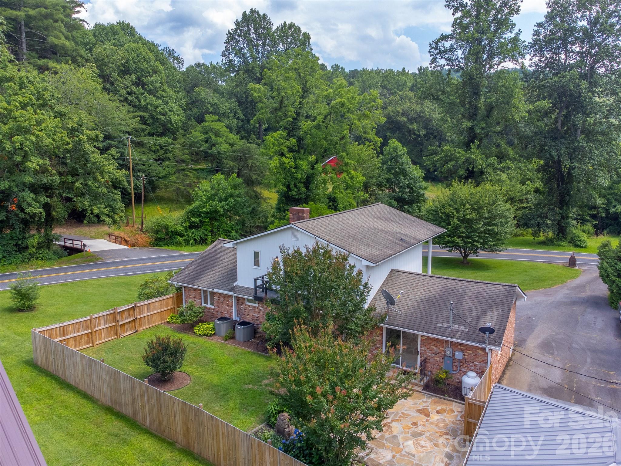 181 Fisher Crk Road Sylva, NC 28779 - Photo 40 of 48 an aerial view of a house with outdoor space and street view