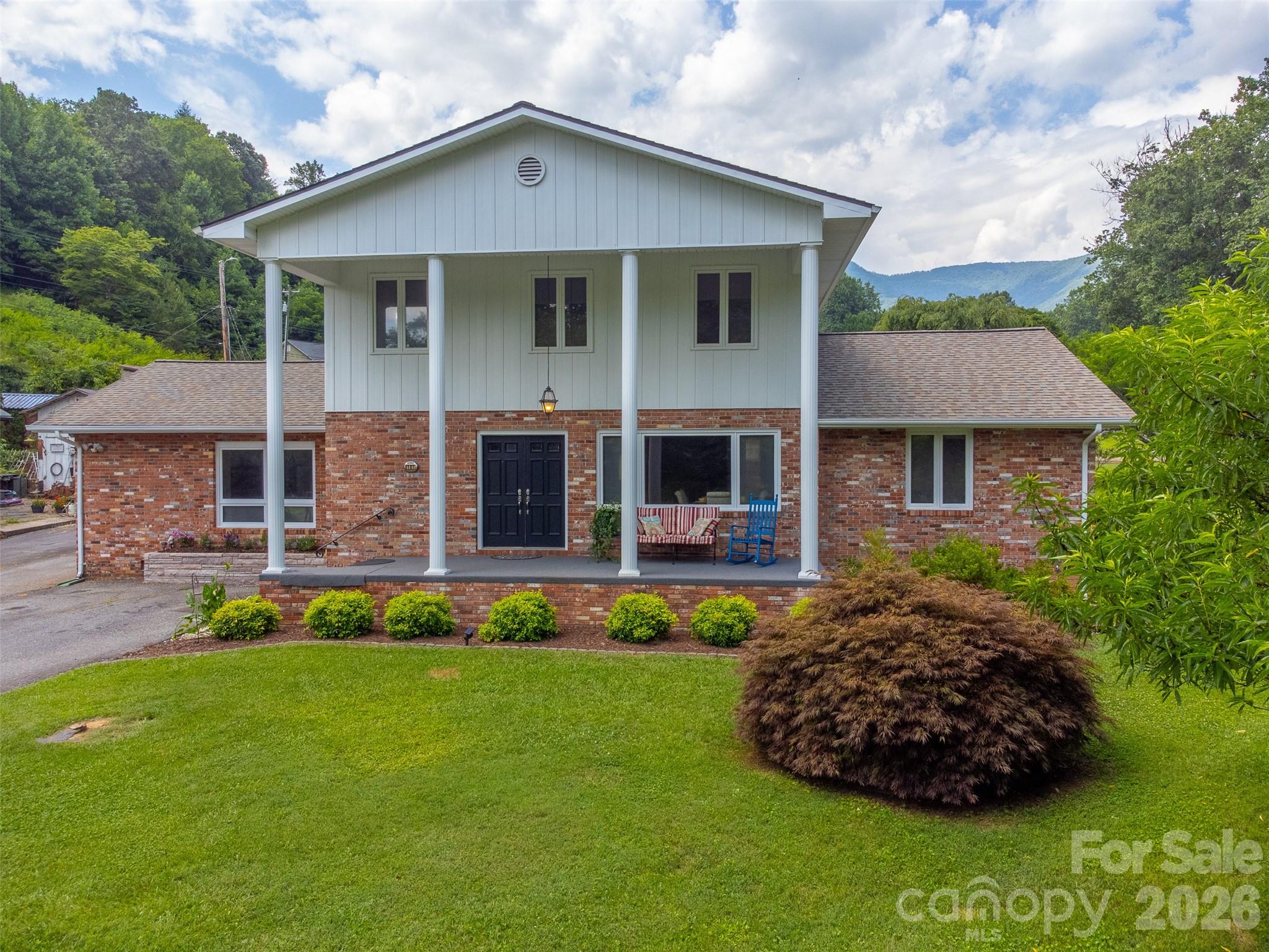 181 Fisher Crk Road Sylva, NC 28779 - Photo 42 of 48 front view of a house with a yard
