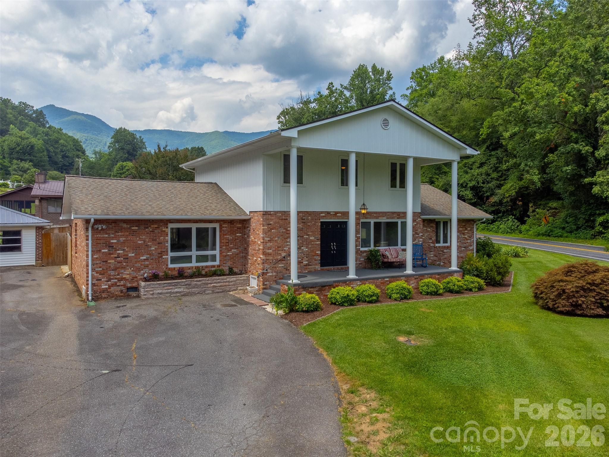 181 Fisher Crk Road Sylva, NC 28779 - Photo 43 of 48 front view of a house with a yard
