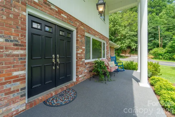 a couple of table and chairs in the porch