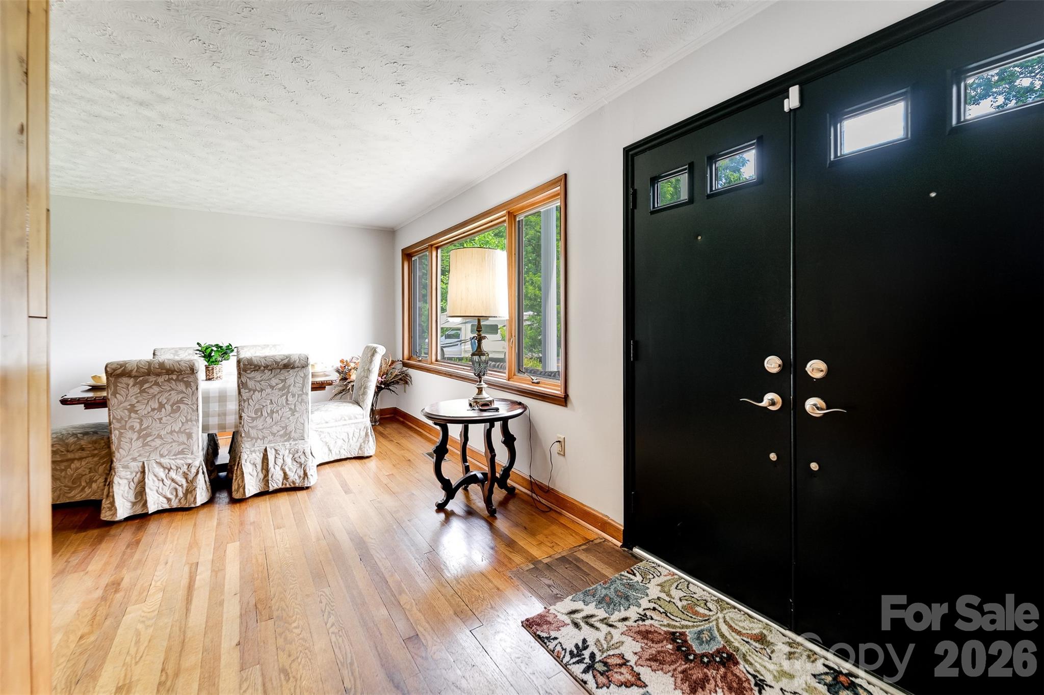 181 Fisher Crk Road Sylva, NC 28779 - Photo 6 of 48 a living room with furniture and wooden floor