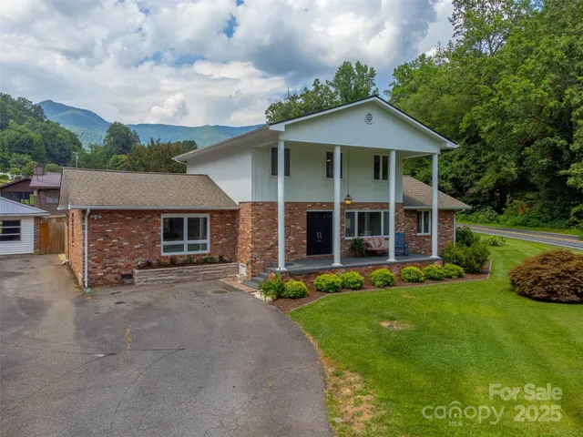 front view of a house with a yard