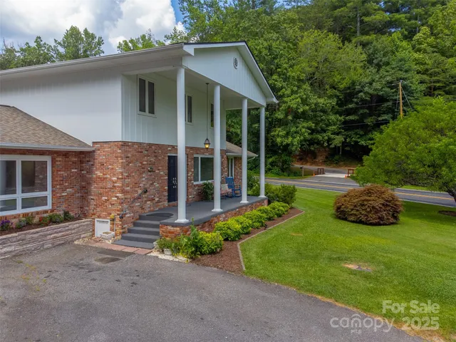 a front view of a house with garden