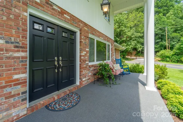 a couple of table and chairs in the porch
