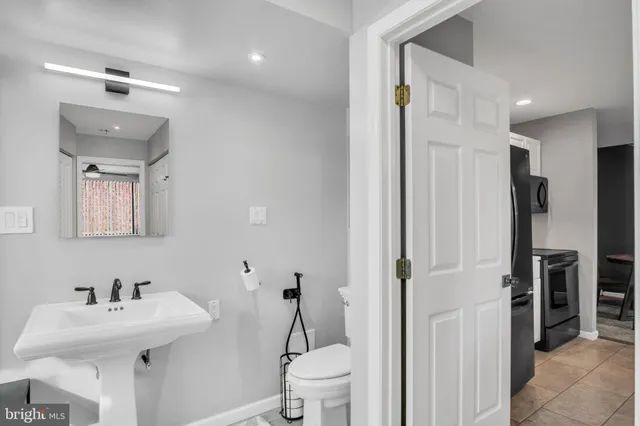 a bedroom with two beds and painted walls