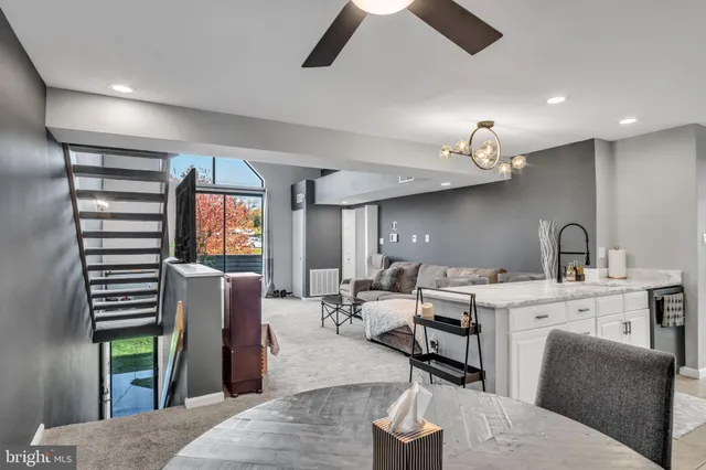 a living room with furniture a window and appliances