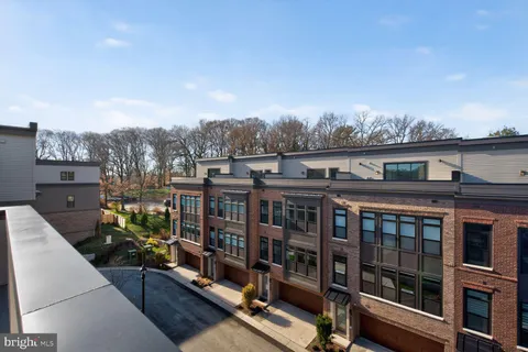 a view of a brick building with many windows