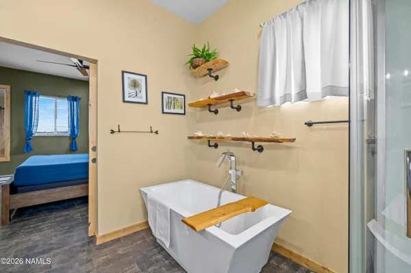 a room with pool table and a window
