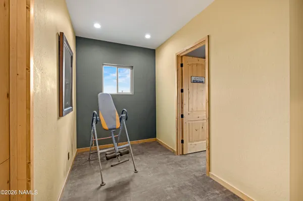 a very nice looking room with gym equipment