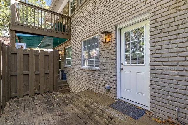 a view of wooden house with a door and wooden floor