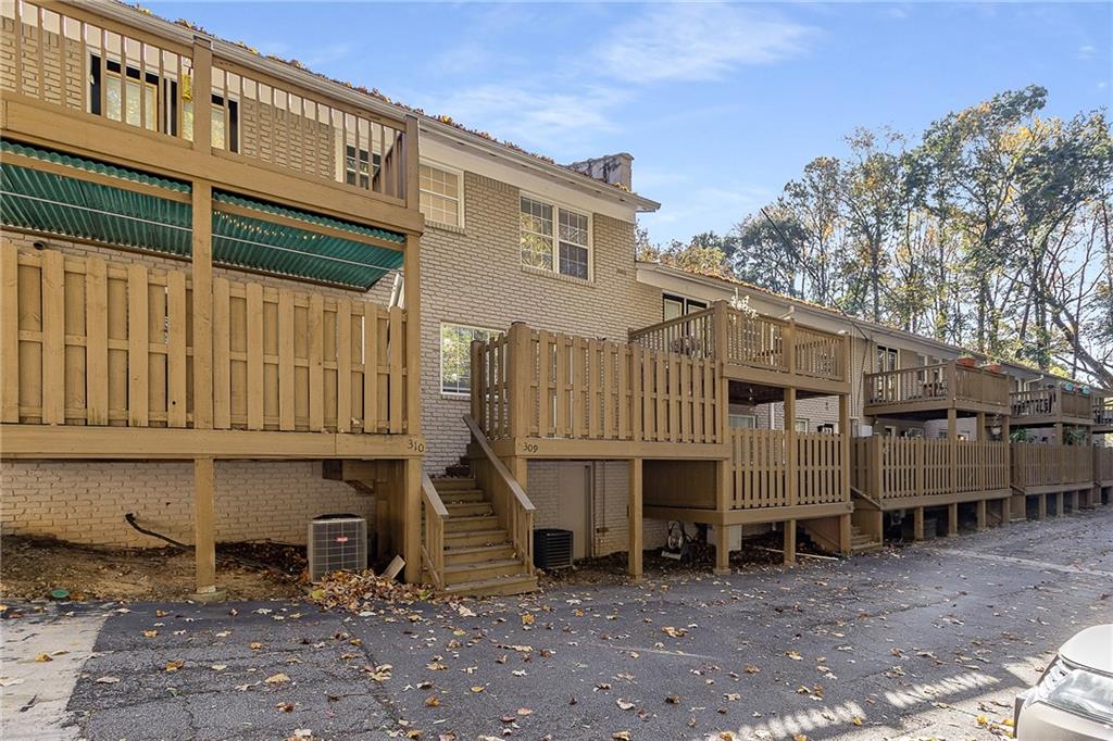 2232 Dunseath Avenue Northwest, Unit 309 Atlanta, GA 30318 - Photo 19 of 25 a view of a house with a yard and deck