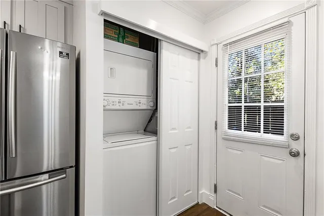 a view of a kitchen with a stove and a refrigerator