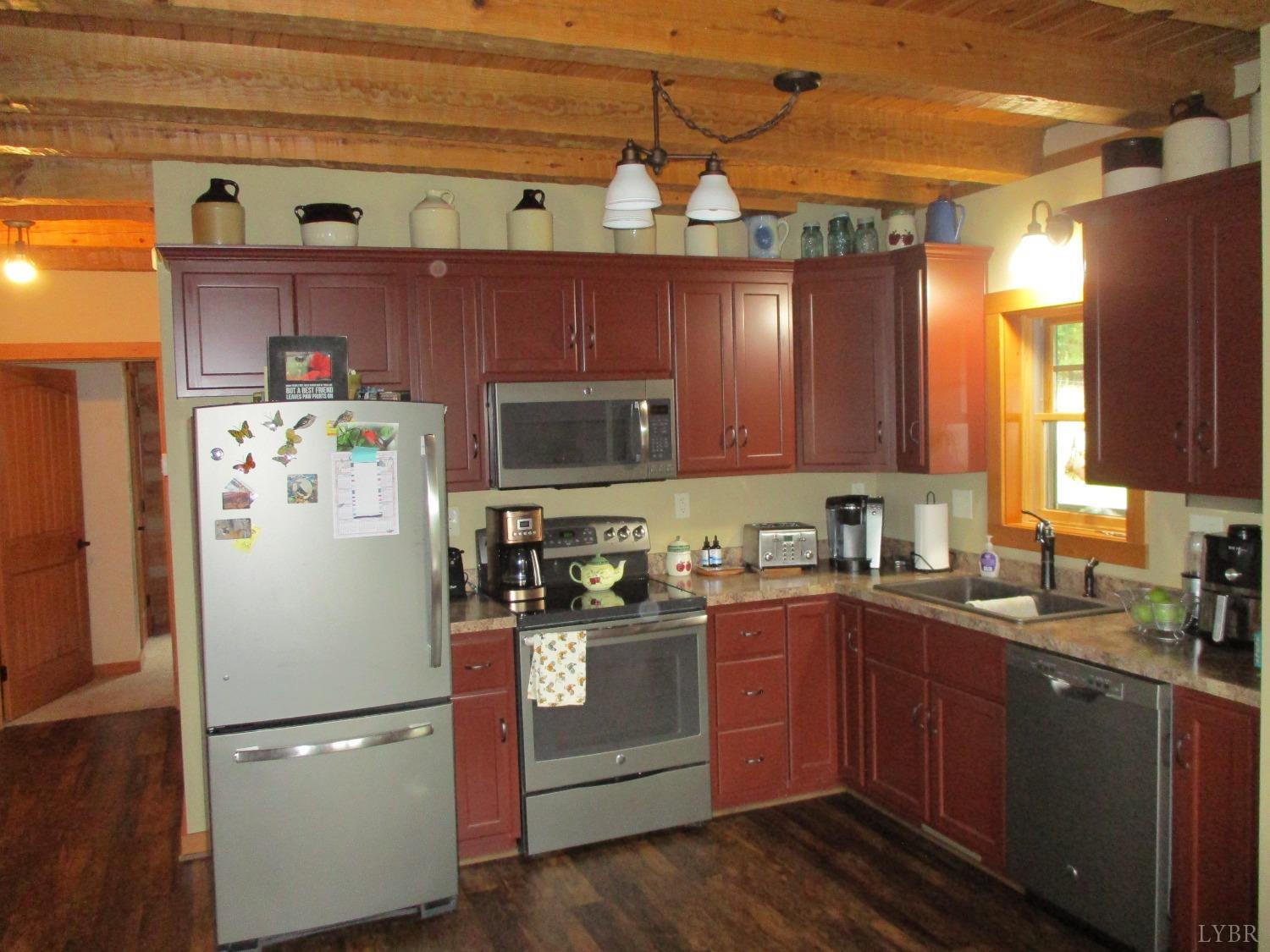 3804 Saunders Road Vinton, VA 24179 - Photo 11 of 50 a kitchen with stainless steel appliances granite countertop a refrigerator a sink a stove a microwave and cabinets