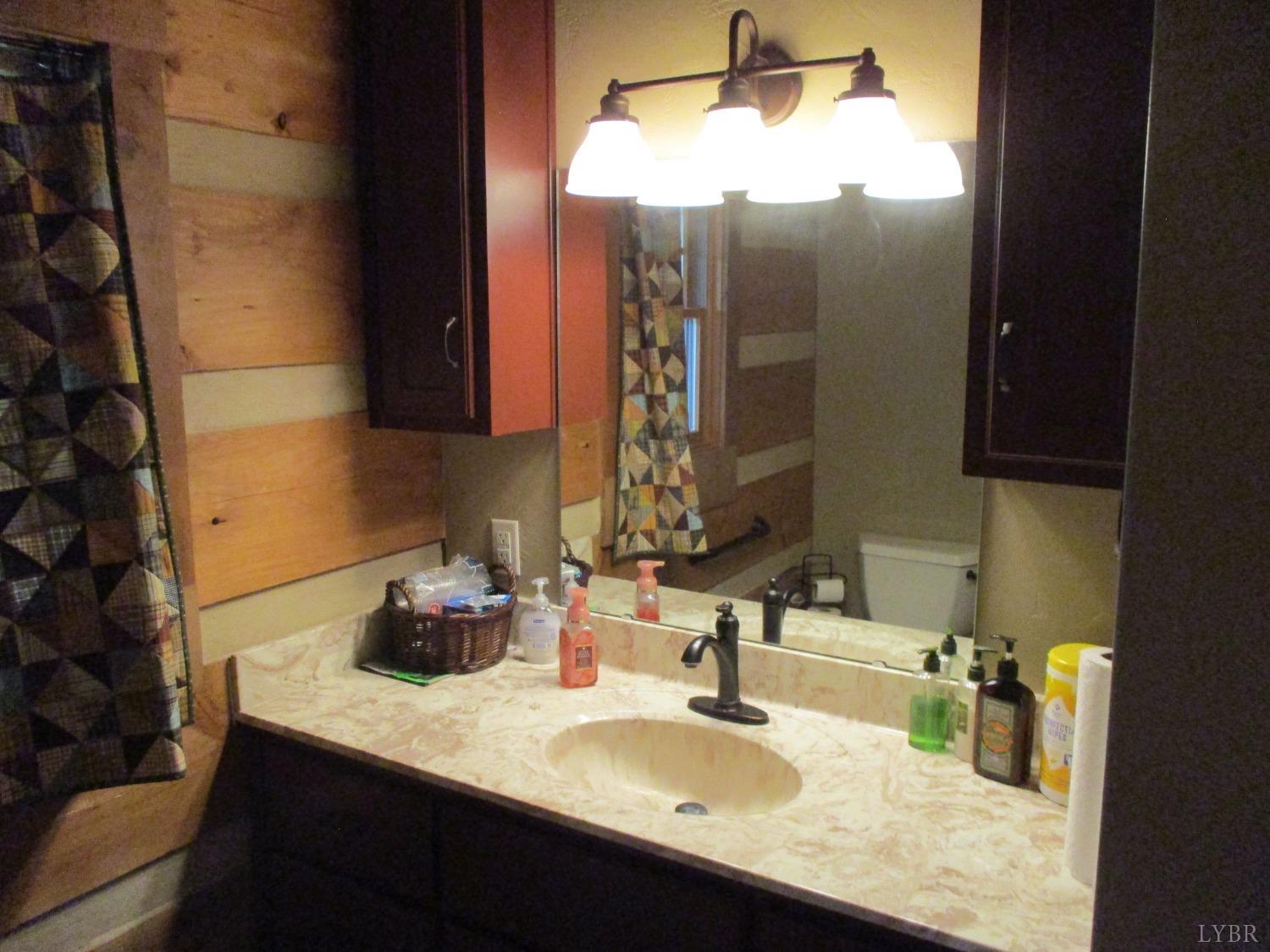 3804 Saunders Road Vinton, VA 24179 - Photo 16 of 50 a bathroom with a sink and a mirror