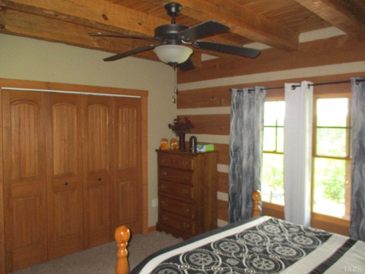 3804 Saunders Road Vinton, VA 24179 - Photo 19 of 50 a bedroom with a bed and wooden floor