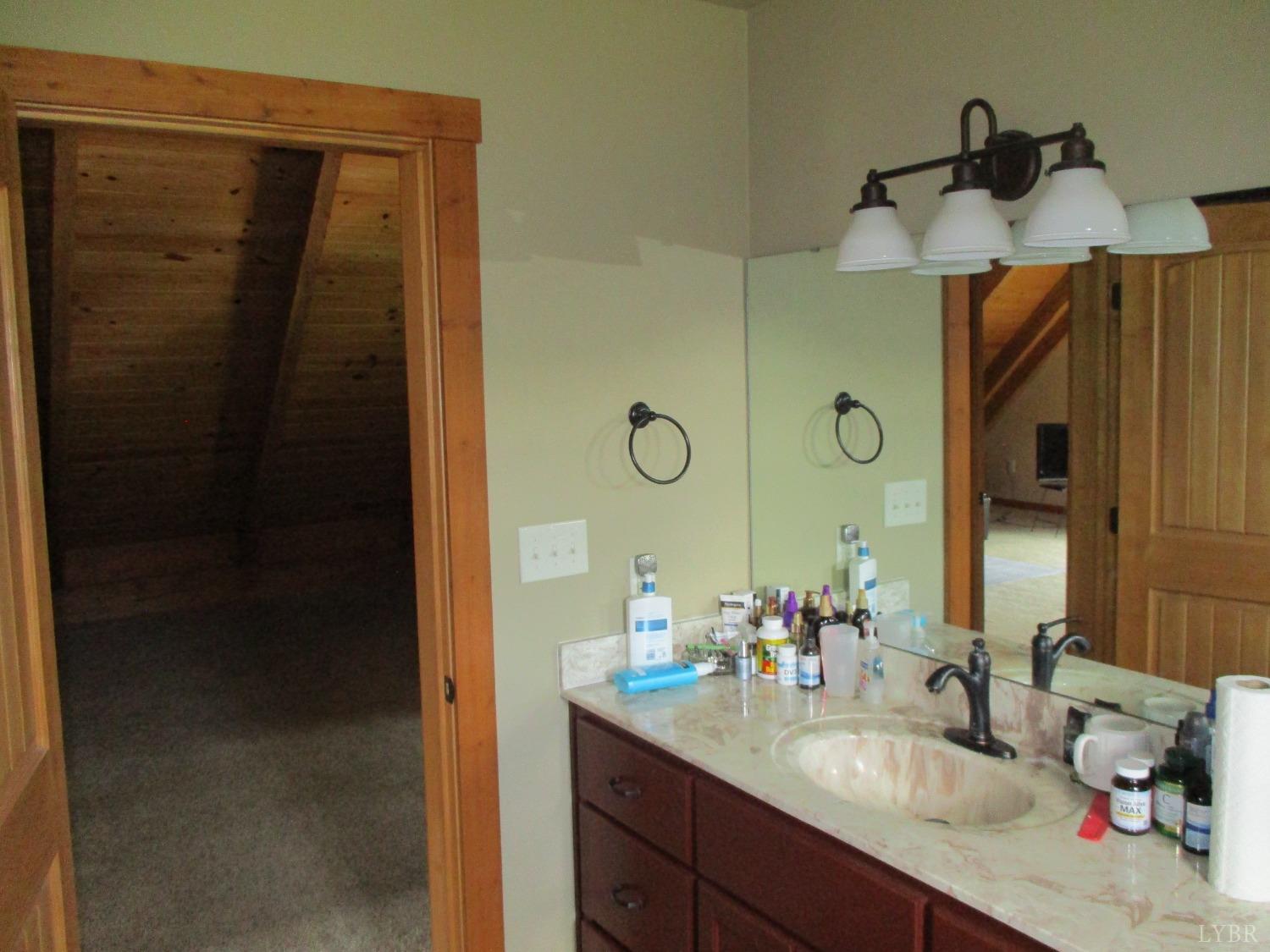 3804 Saunders Road Vinton, VA 24179 - Photo 35 of 50 a bathroom with a granite countertop sink and a mirror