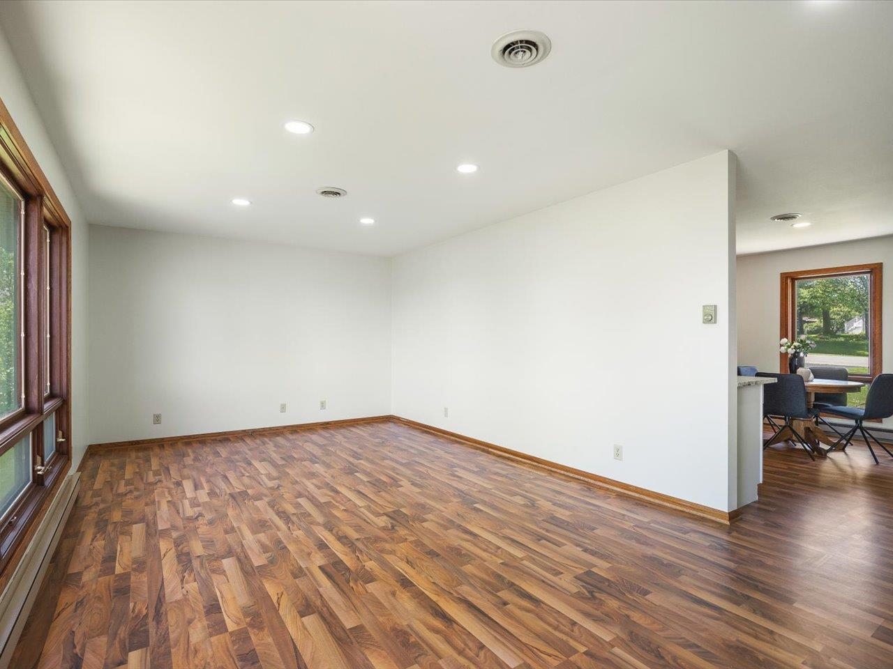 136 Lake Summerset Road Lake Summerset, IL 61019 - Photo 12 of 47 a view of empty room with wooden floor and fireplace