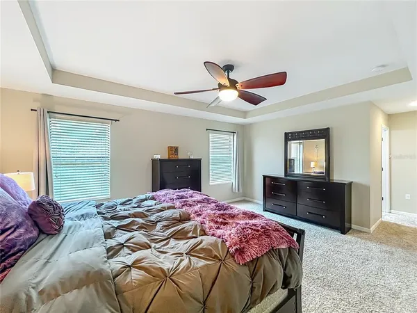 a bedroom with a bed and a dresser